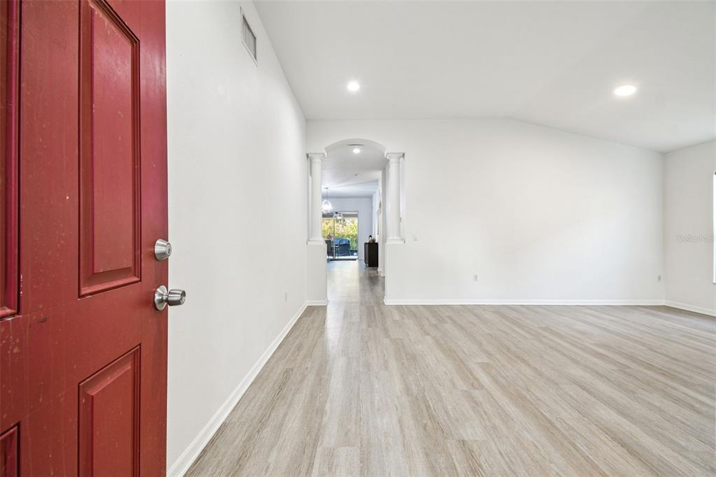 11478 Weston Course Loop Riverview, FL 33579 - Photo 6 of 30 a view of a hallway with wooden floor and staircase