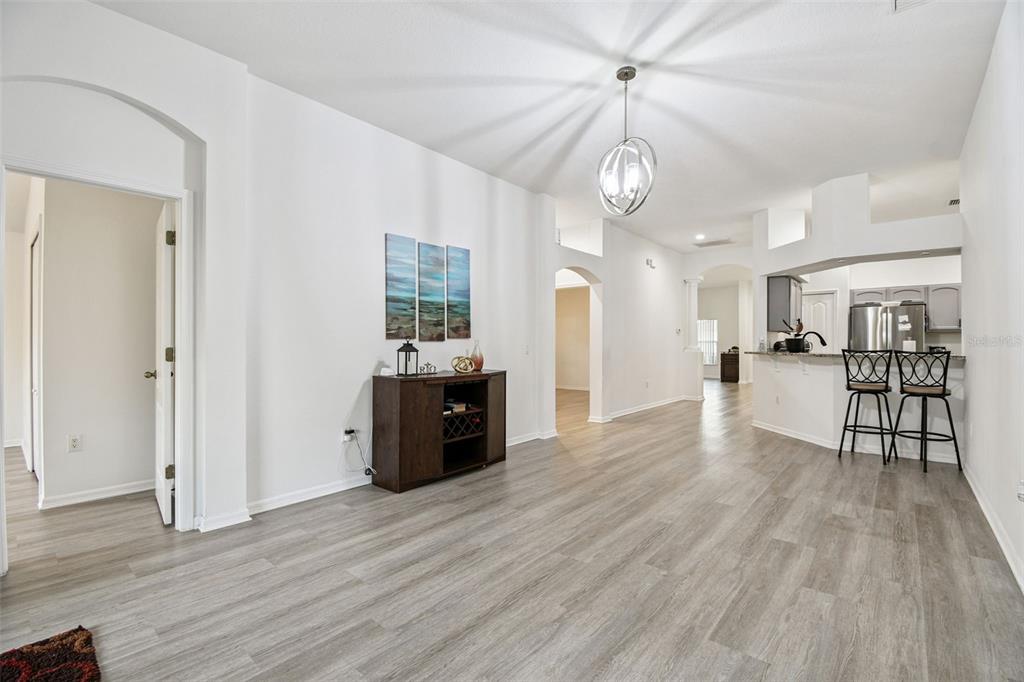 11478 Weston Course Loop Riverview, FL 33579 - Photo 9 of 30 a view of a kitchen with cabinets and wooden floor