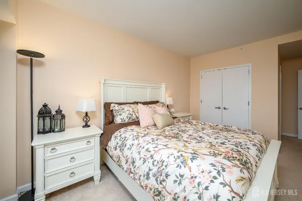 a bedroom with a bed and closet