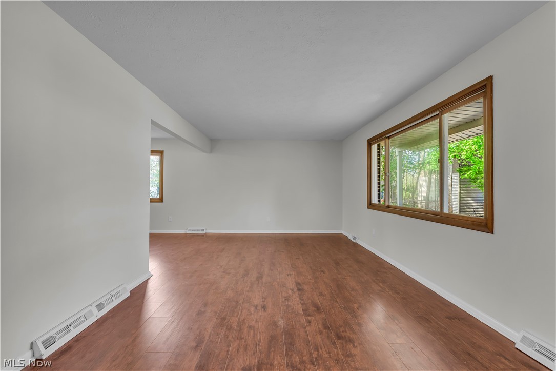 2540 Charney Road University Heights, OH 44118 - Photo 7 of 44 Bright interior space featuring wood-finish flooring, white baseboards, and light-colored walls