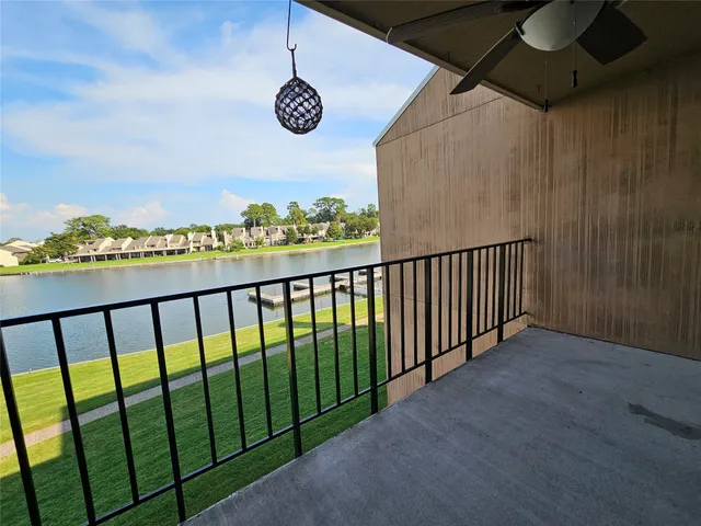 a view of a lake with houses in the back