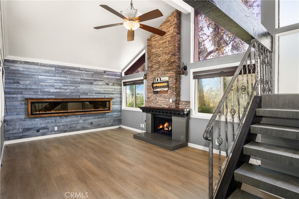a view of living room with furniture and a fireplace