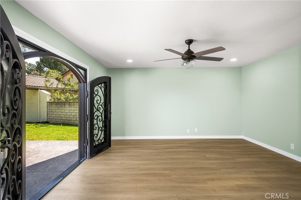 5554 East Vista Del Rio Anaheim, CA 92807 - Photo 14 of 42 wooden floor in an empty room with a window
