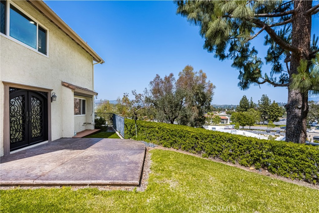 5554 East Vista Del Rio Anaheim, CA 92807 - Photo 23 of 42 a front view of a house with garden