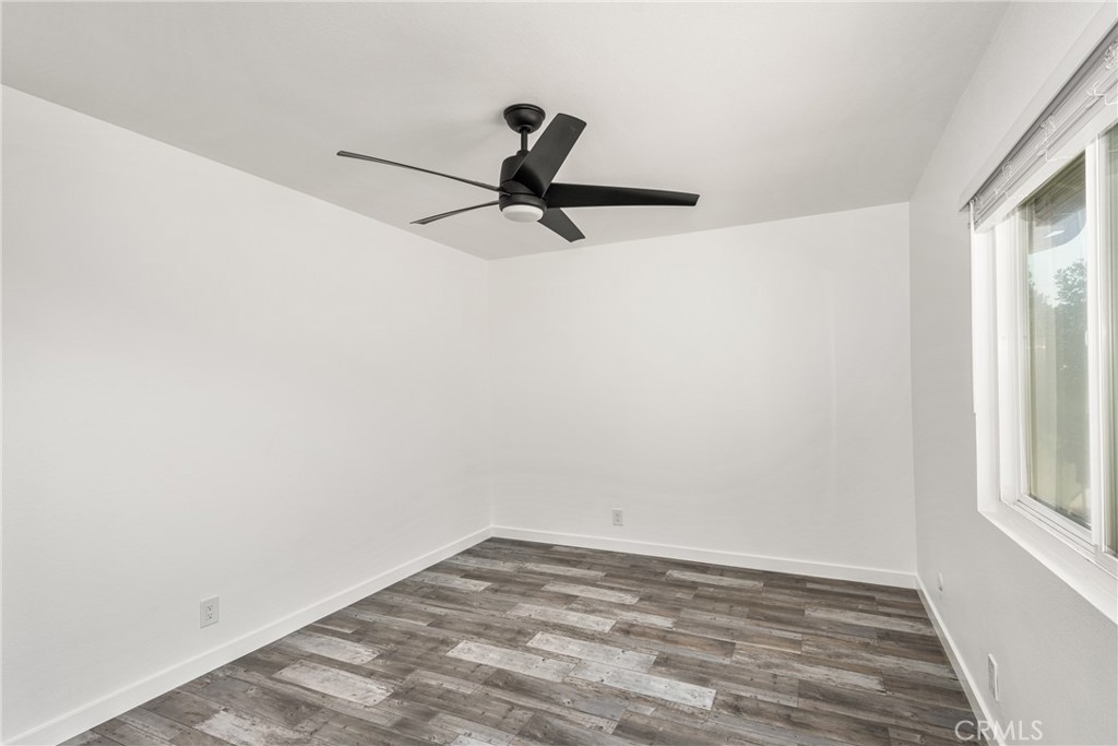 5554 East Vista Del Rio Anaheim, CA 92807 - Photo 26 of 42 a view of a room with a window and a ceiling fan