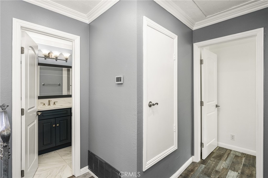 5554 East Vista Del Rio Anaheim, CA 92807 - Photo 28 of 42 a view of hallway with sink and wooden floor