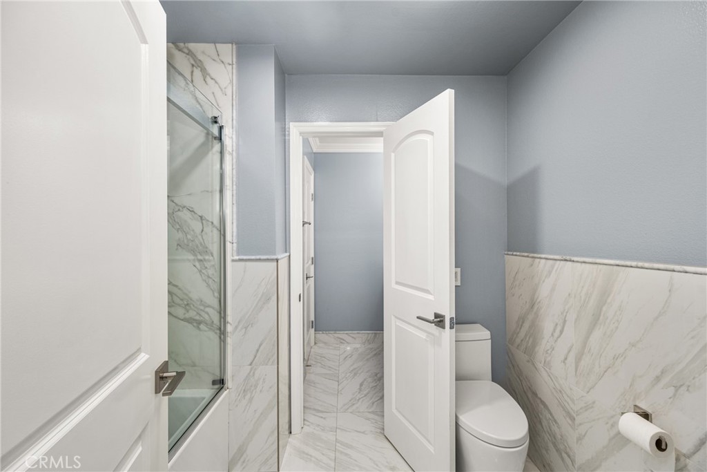 5554 East Vista Del Rio Anaheim, CA 92807 - Photo 30 of 42 a bathroom with a shower and a toilet