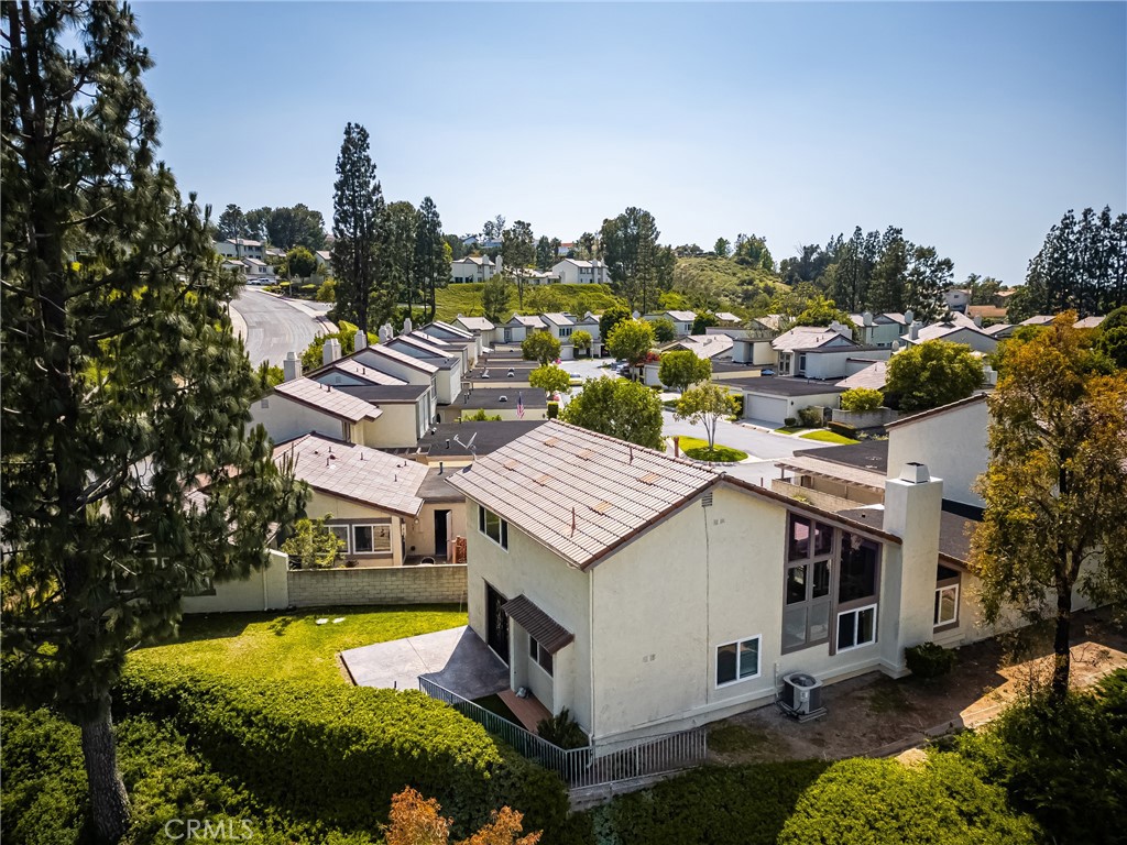 5554 East Vista Del Rio Anaheim, CA 92807 - Photo 3 of 42 an aerial view of a house with a garden and houses