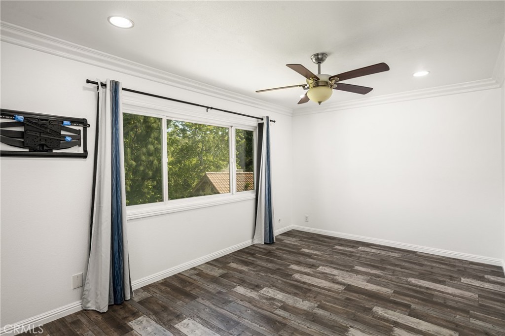 5554 East Vista Del Rio Anaheim, CA 92807 - Photo 32 of 42 a view of a livingroom with a ceiling fan and window