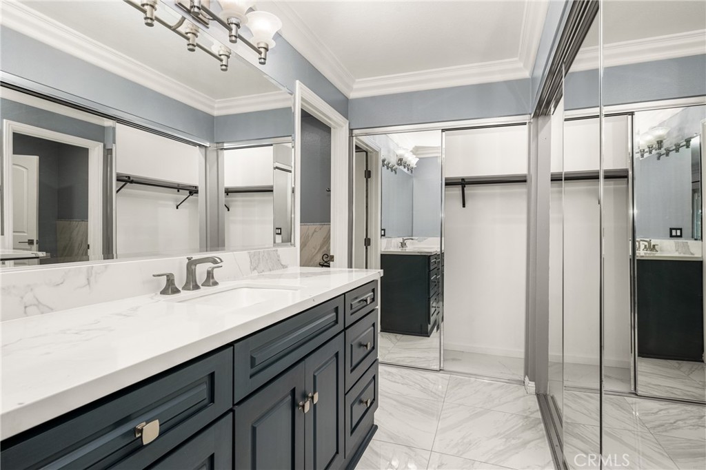 5554 East Vista Del Rio Anaheim, CA 92807 - Photo 34 of 42 a bathroom with a sink double vanity and a mirror