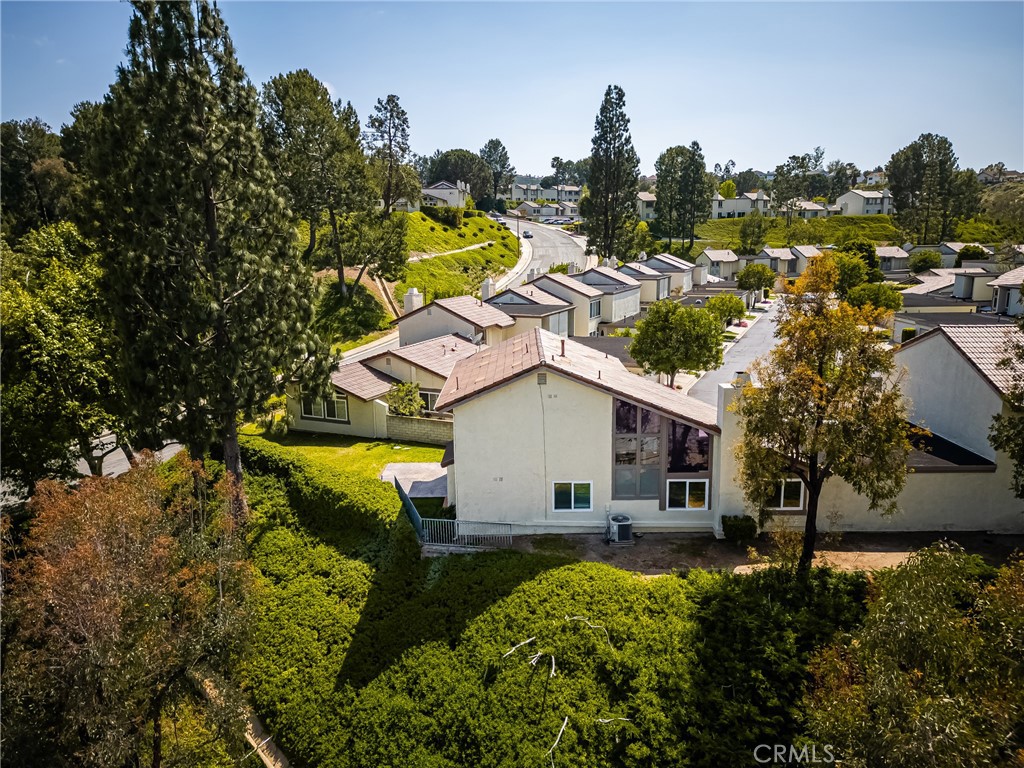 5554 East Vista Del Rio Anaheim, CA 92807 - Photo 38 of 42 an aerial view of a house with swimming pool and lake view