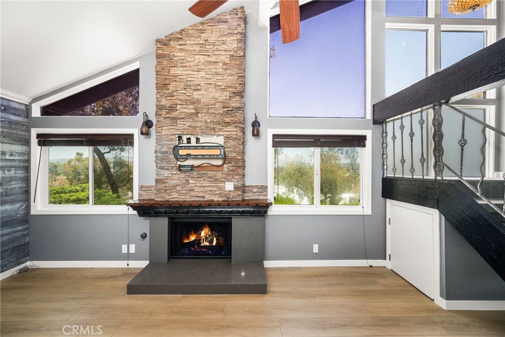 5554 East Vista Del Rio Anaheim, CA 92807 - Photo 9 of 42 a view of an empty room with wooden floor and a window
