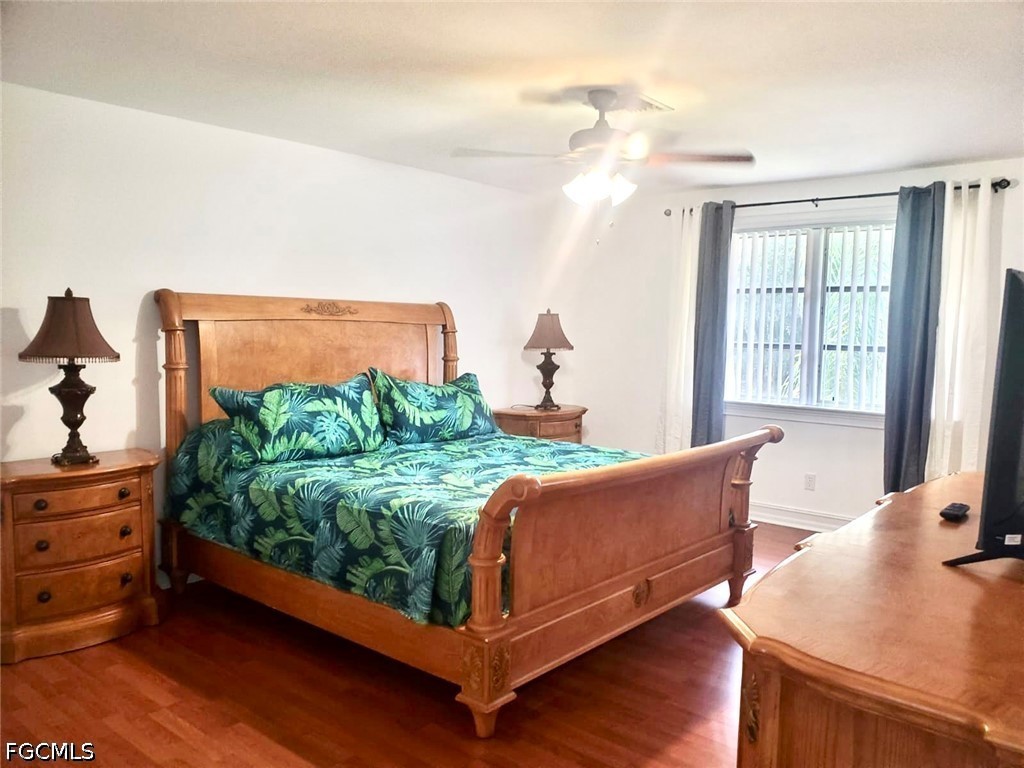 740 19th Street Southwest Naples, FL 34117 - Photo 29 of 35 a bed room with a bed window and mirror