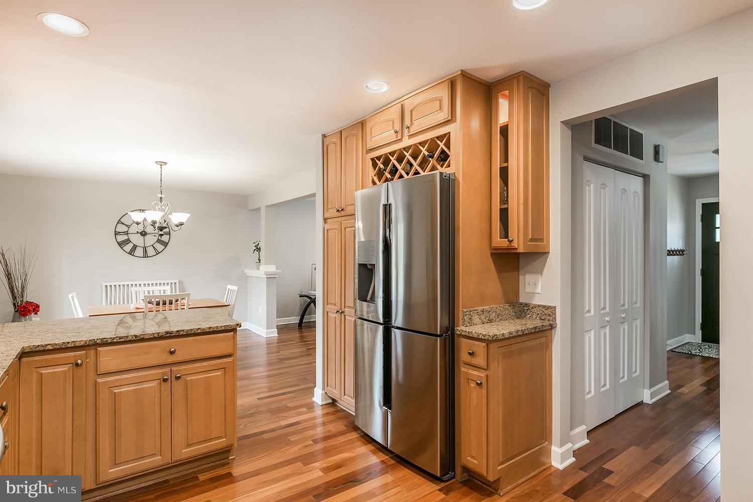 2425 Bramblebush Court Reston, VA 20191 - Photo 14 of 30 a kitchen with stainless steel appliances granite countertop a refrigerator and a sink