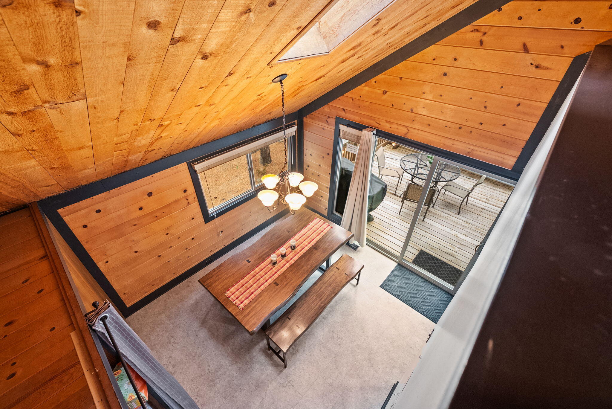57377 Overlook Road Sunriver, OR 97707 - Photo 36 of 50 Looking down from the upper second level loft into the dining room.
