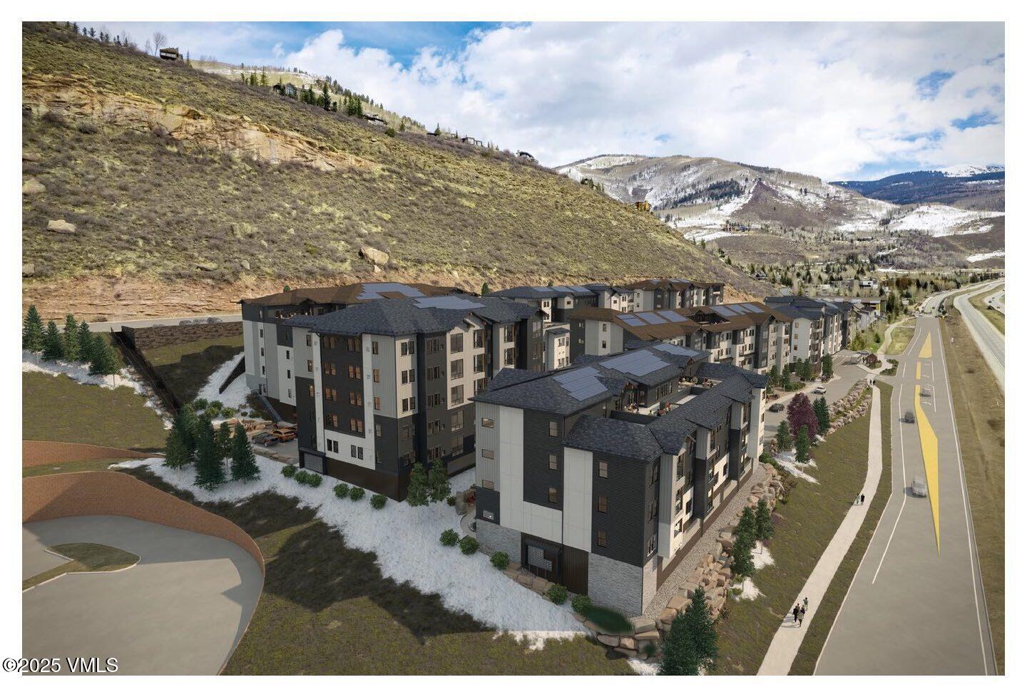 1281 North Frontage Road West, Unit A303 Vail, CO 81657 - Photo 9 of 14 a view of a house with a yard in front of it