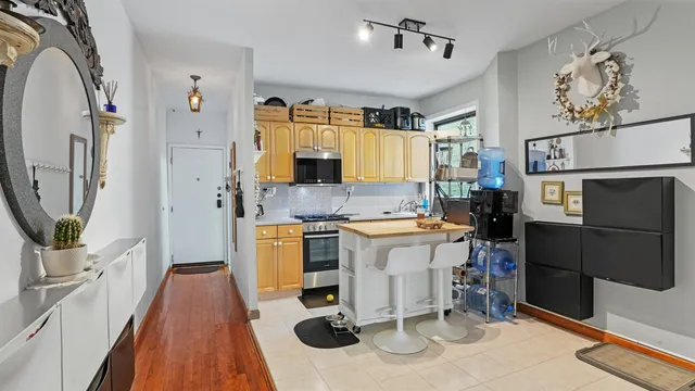 a kitchen with a sink appliances and cabinets