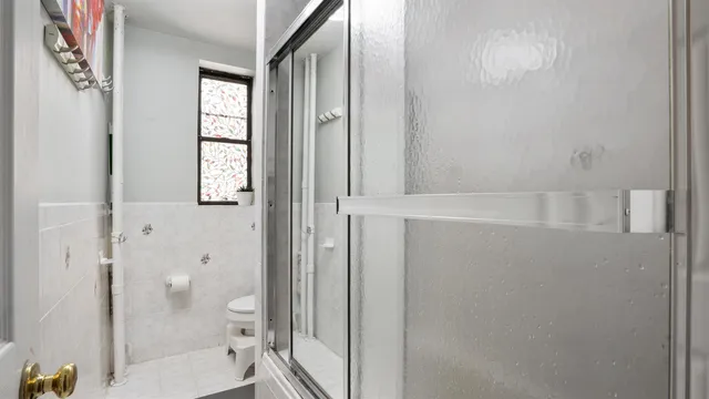 a bathroom with a sink mirror vanity and toilet