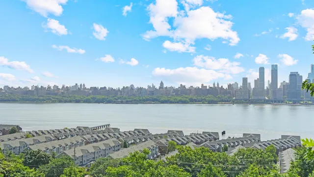 a view of a lake with houses in the back