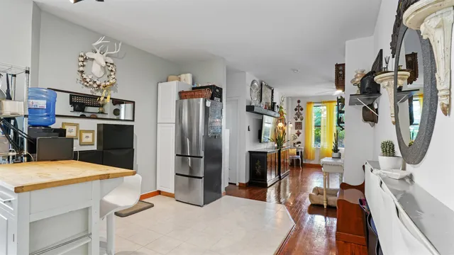 a kitchen with stainless steel appliances a refrigerator and a stove