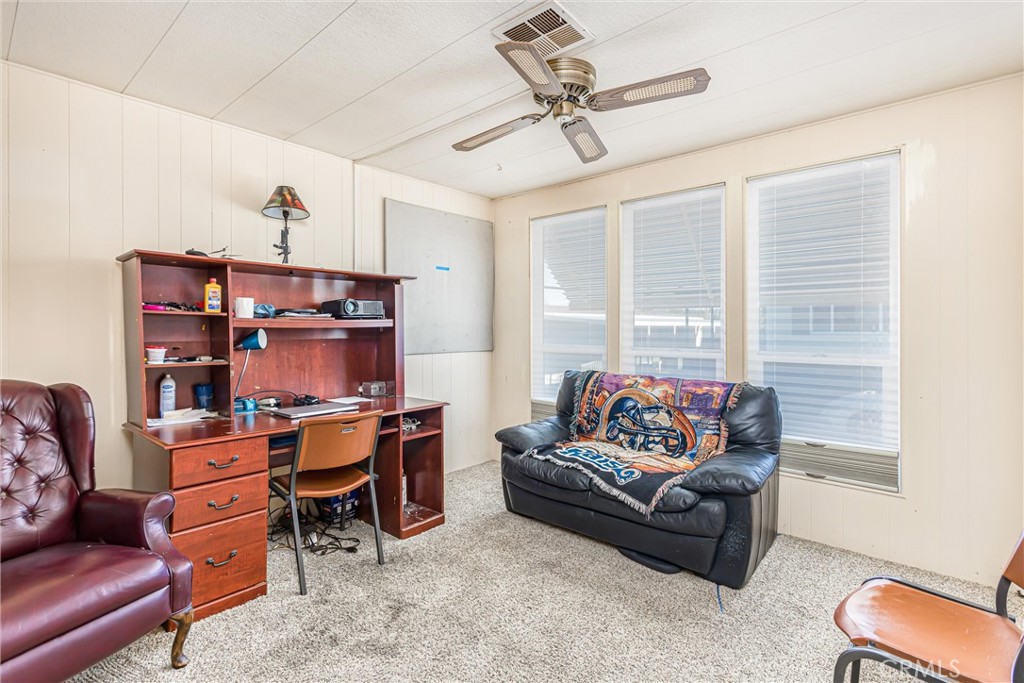4000 Pierce Street, Unit 106 Riverside, CA 92505 - Photo 11 of 18 a living room with furniture cabinets and window