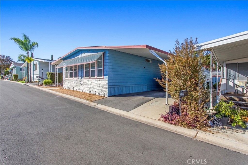 4000 Pierce Street, Unit 106 Riverside, CA 92505 - Photo 16 of 18 a front view of a house with a yard