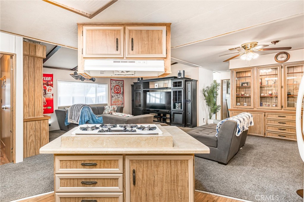 4000 Pierce Street, Unit 106 Riverside, CA 92505 - Photo 6 of 18 a kitchen with a stove a refrigerator and a fireplace