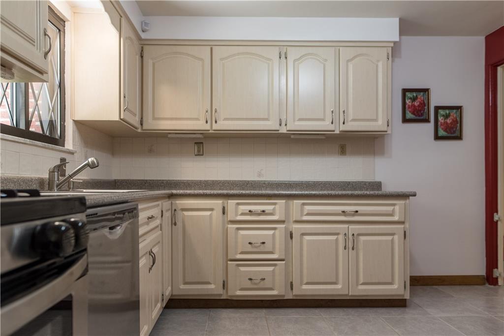 333 West Bruceton Road Pittsburgh, PA 15236 - Photo 5 of 18 Updated kitchen with brand new dishwasher, backsplash and ceramic tile. Gas stove was also converted from electric when owners moved in.