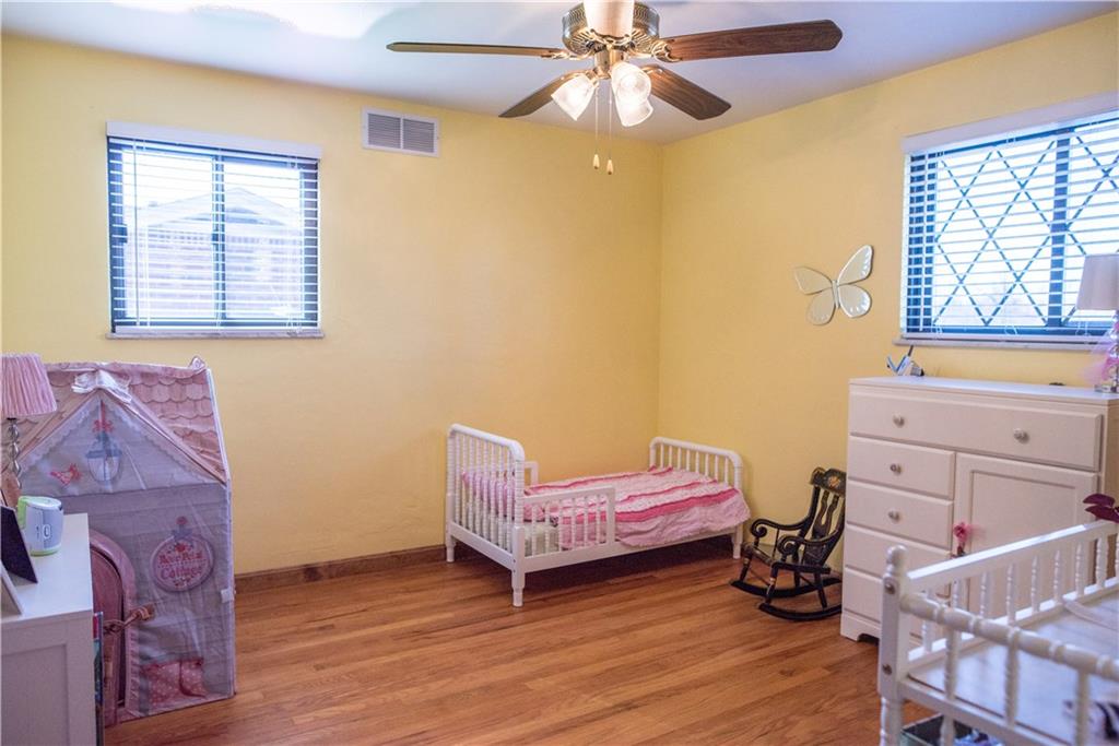 333 West Bruceton Road Pittsburgh, PA 15236 - Photo 9 of 18 2nd bedroom offers refinished hardwood floors.