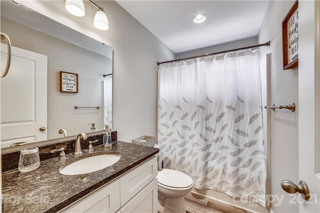 225 Stone Road Salisbury, NC 28146 - Photo 13 of 21 a bathroom with a granite countertop sink and a mirror
