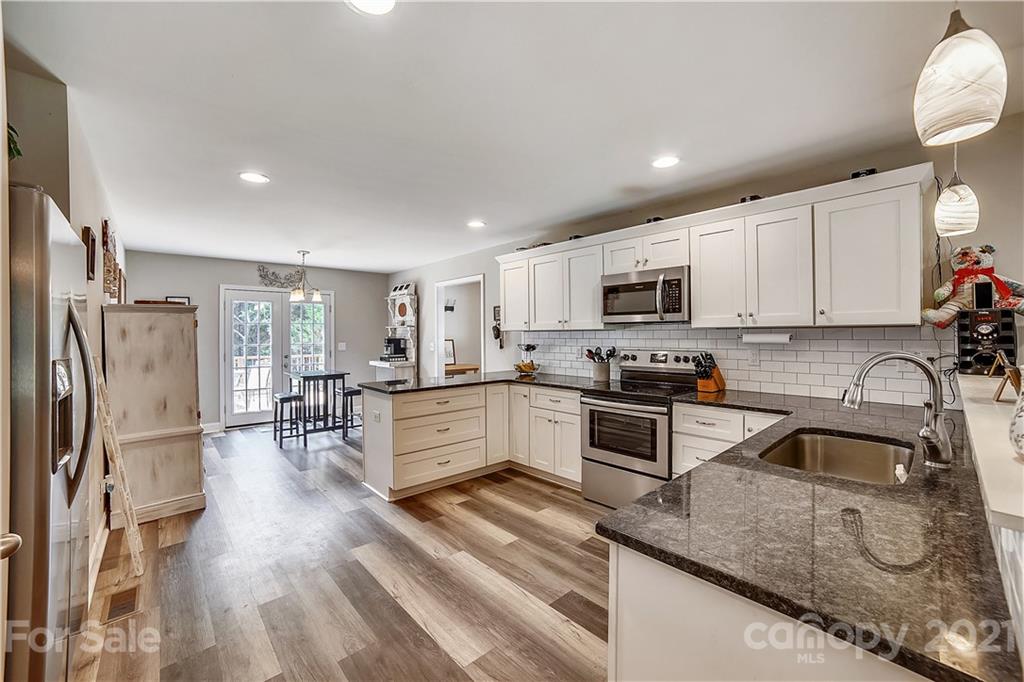 225 Stone Road Salisbury, NC 28146 - Photo 6 of 21 a kitchen with stainless steel appliances granite countertop a refrigerator sink and stove