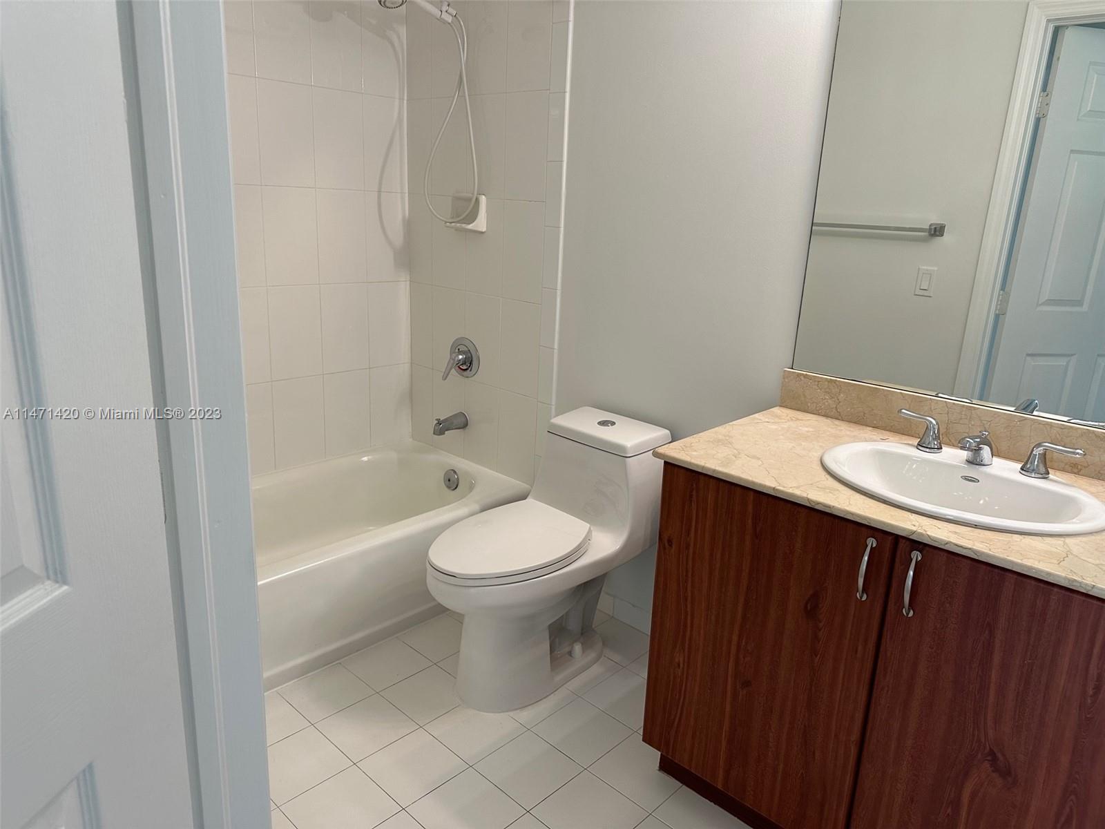Silver Bluff Estates Miami, FL 33145 - Photo 11 of 27 a bathroom with a sink a toilet and shower