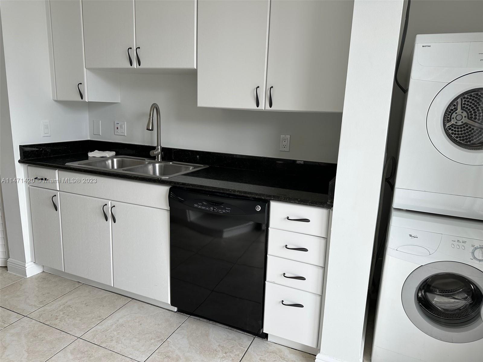 Silver Bluff Estates Miami, FL 33145 - Photo 13 of 27 a kitchen with a sink and a stove
