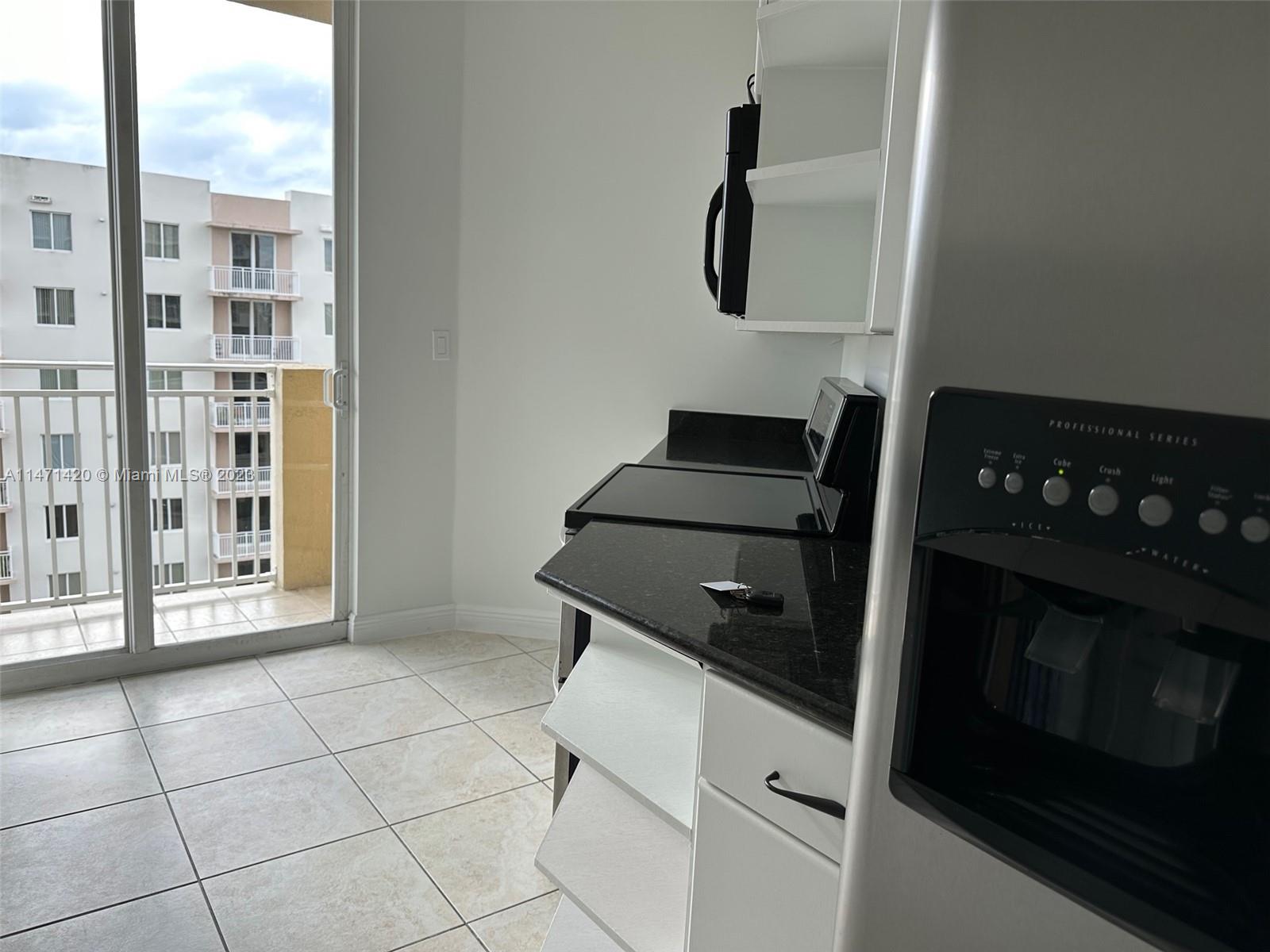 Silver Bluff Estates Miami, FL 33145 - Photo 15 of 27 a kitchen with a stove and a cabinet