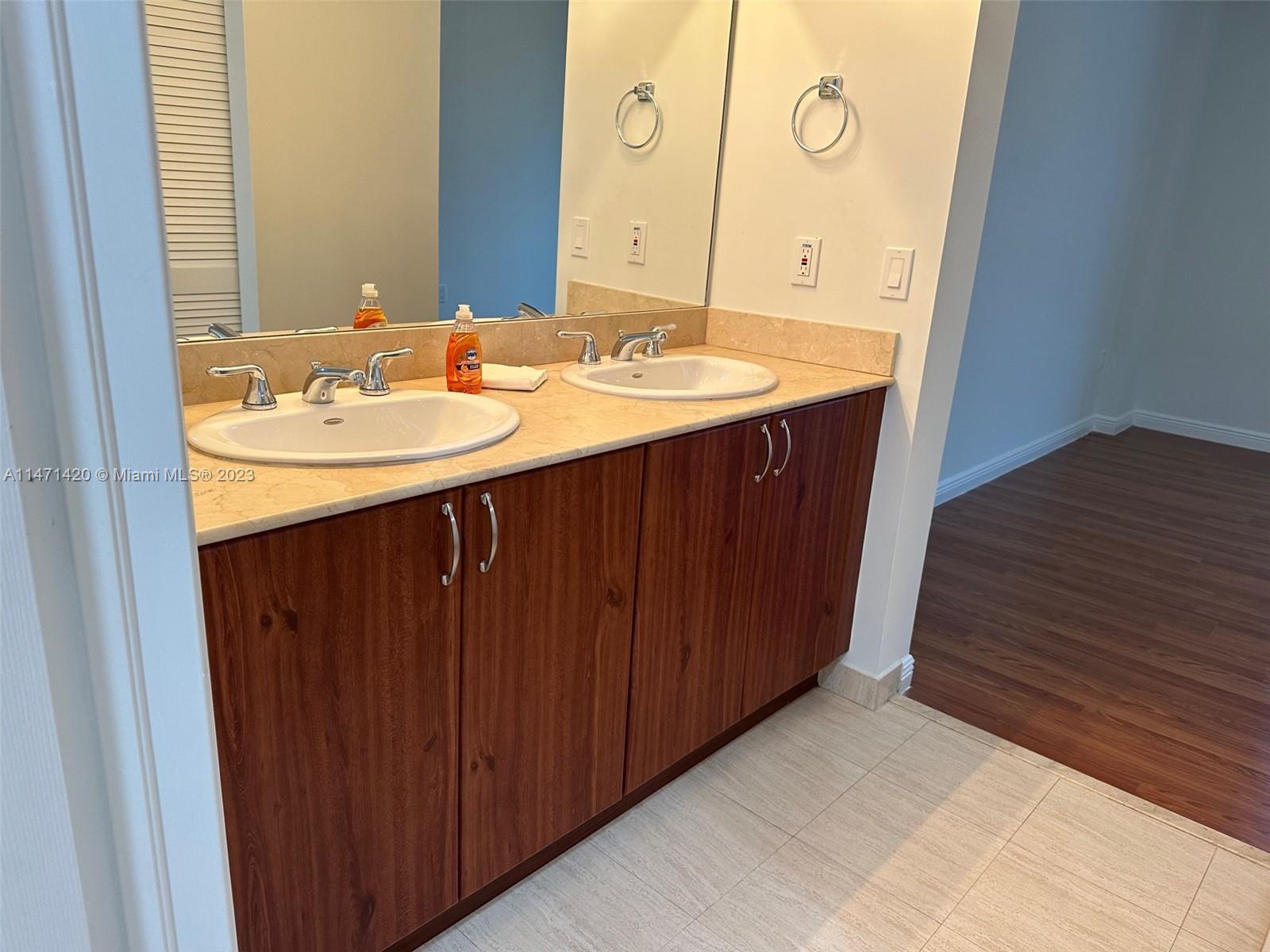 Silver Bluff Estates Miami, FL 33145 - Photo 19 of 27 a bathroom with a sink vanity and a mirror