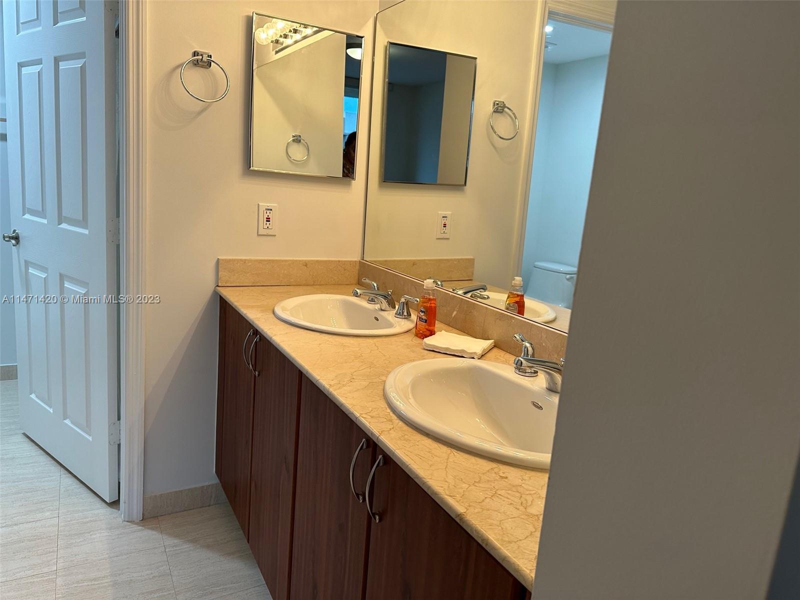 Silver Bluff Estates Miami, FL 33145 - Photo 20 of 27 a bathroom with a granite countertop sink and a mirror