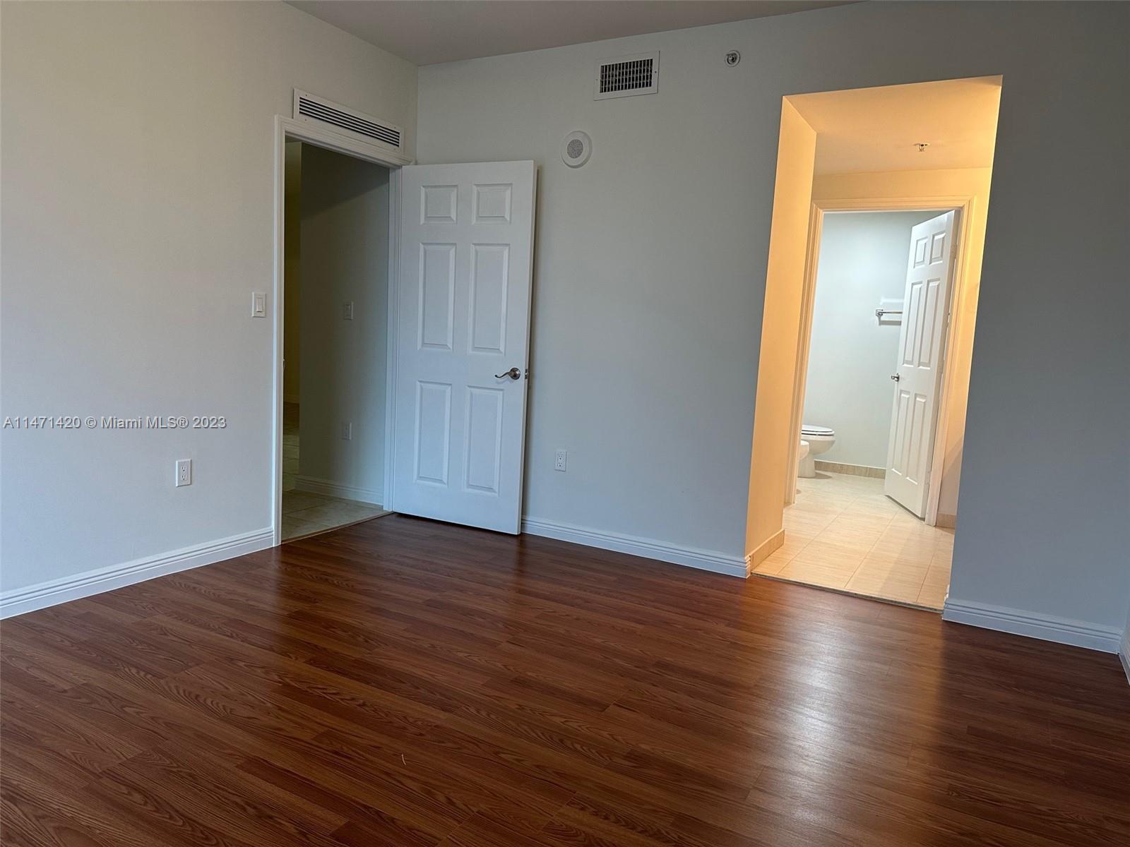 Silver Bluff Estates Miami, FL 33145 - Photo 24 of 27 an empty room with wooden floor and closet