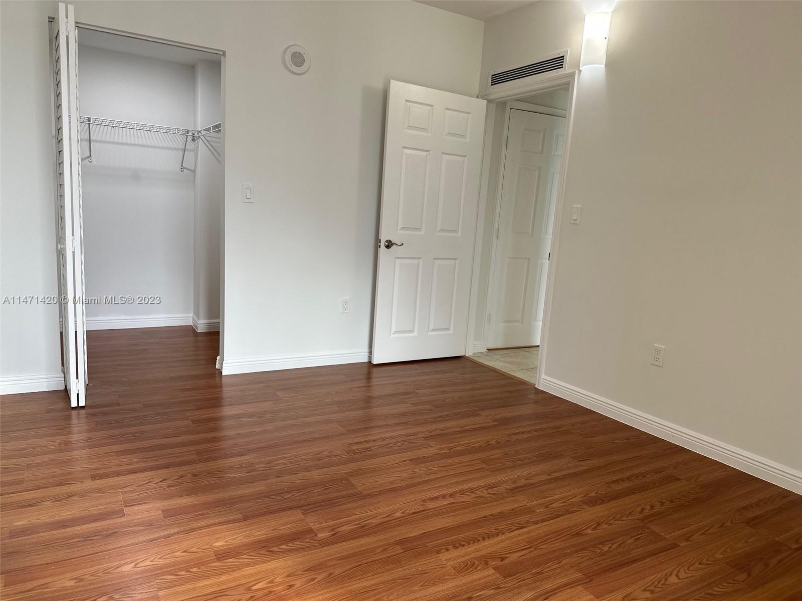 Silver Bluff Estates Miami, FL 33145 - Photo 8 of 27 a view of an empty room with wooden floor and a bathroom