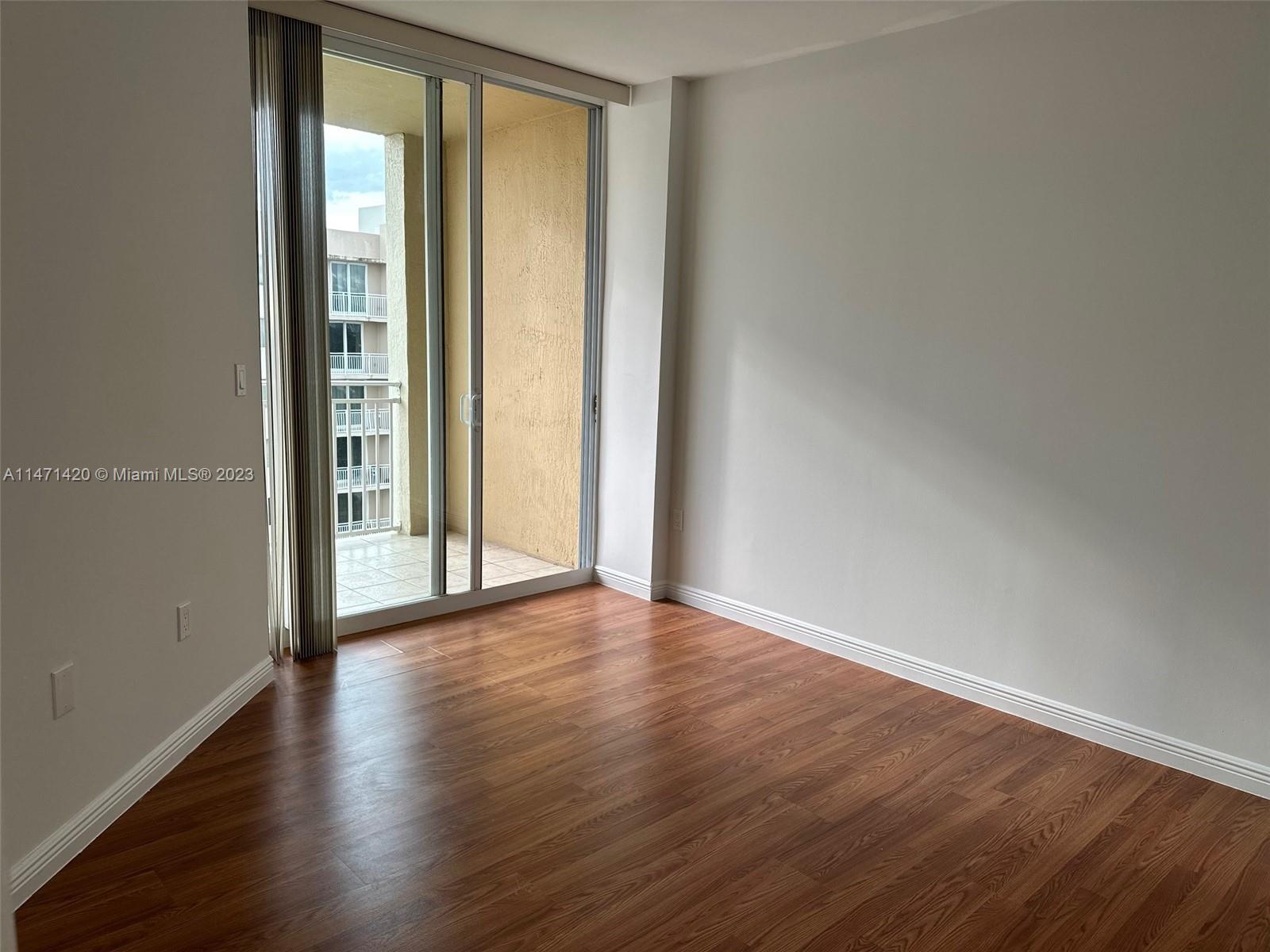 Silver Bluff Estates Miami, FL 33145 - Photo 9 of 27 a view of an empty room with wooden floor and a window