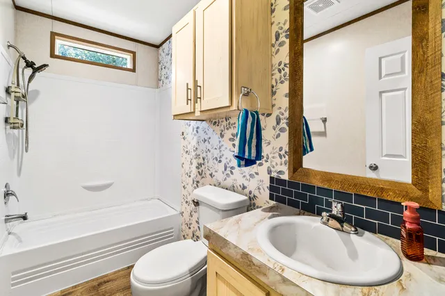 a kitchen with stainless steel appliances a stove a refrigerator and a sink