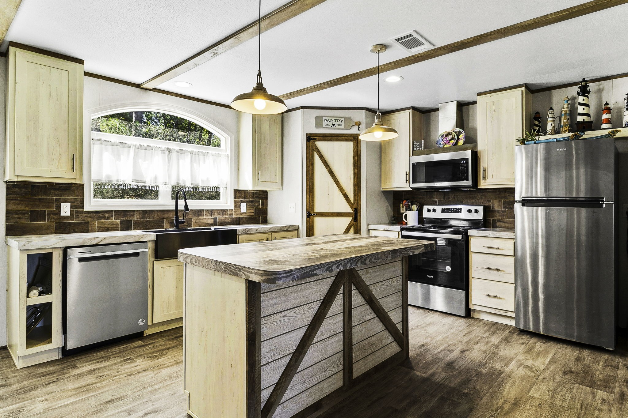 41 Ferguson Way Point Blank, TX 77364 - Photo 14 of 34 a kitchen with stainless steel appliances a stove a refrigerator and a sink