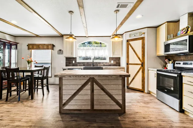 a dining room with furniture and window