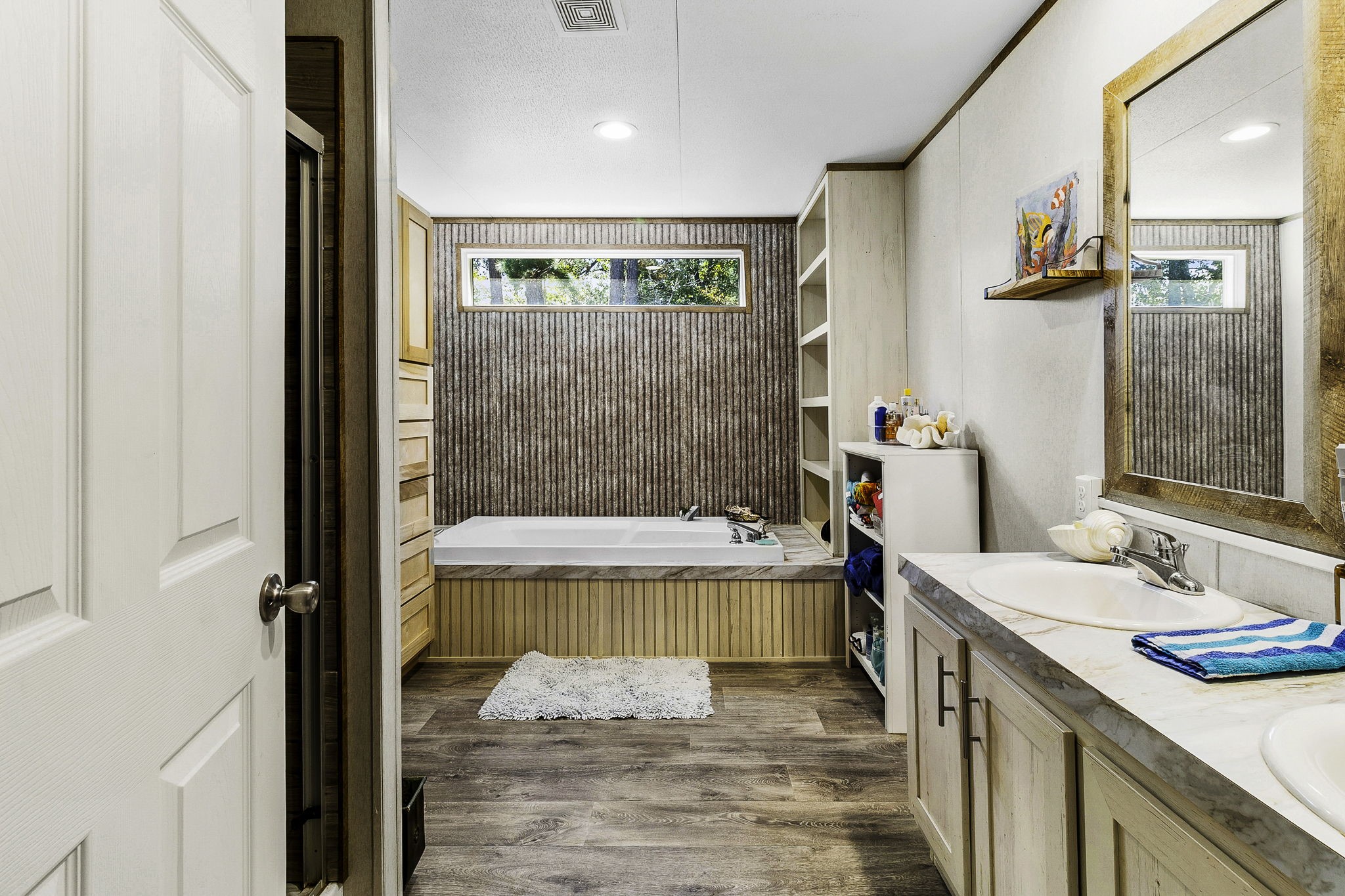 41 Ferguson Way Point Blank, TX 77364 - Photo 20 of 34 a bathroom with a tub sink and mirror