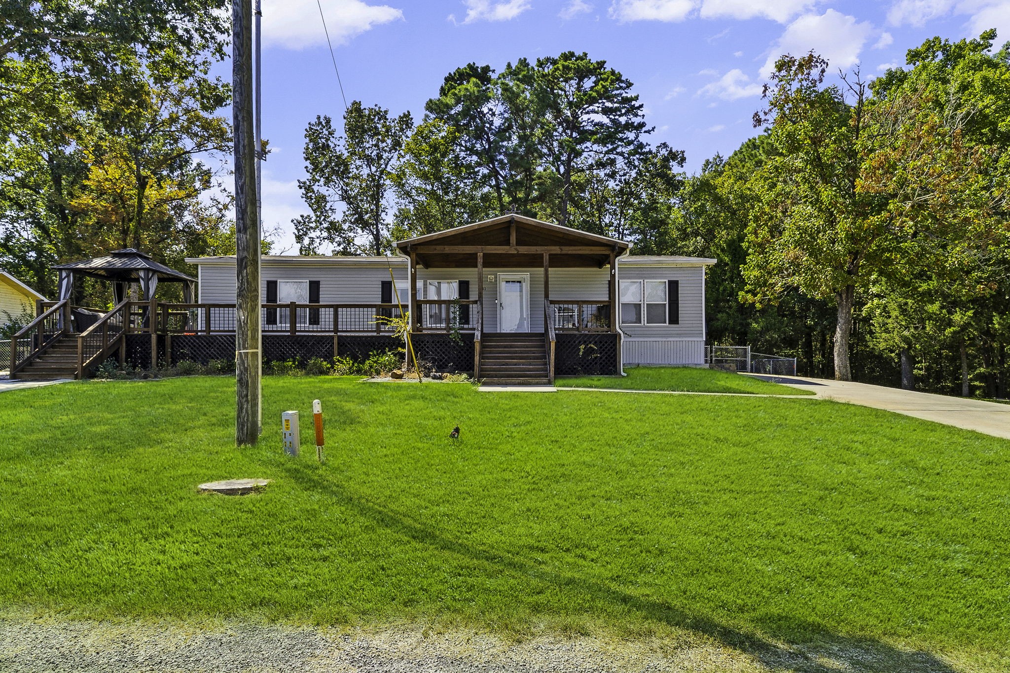 41 Ferguson Way Point Blank, TX 77364 - Photo 2 of 34 a view of a house with a yard and sitting area