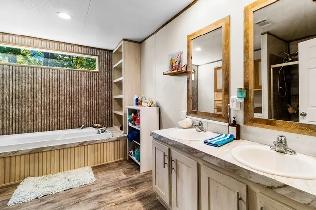 a bathroom with a tub and shower