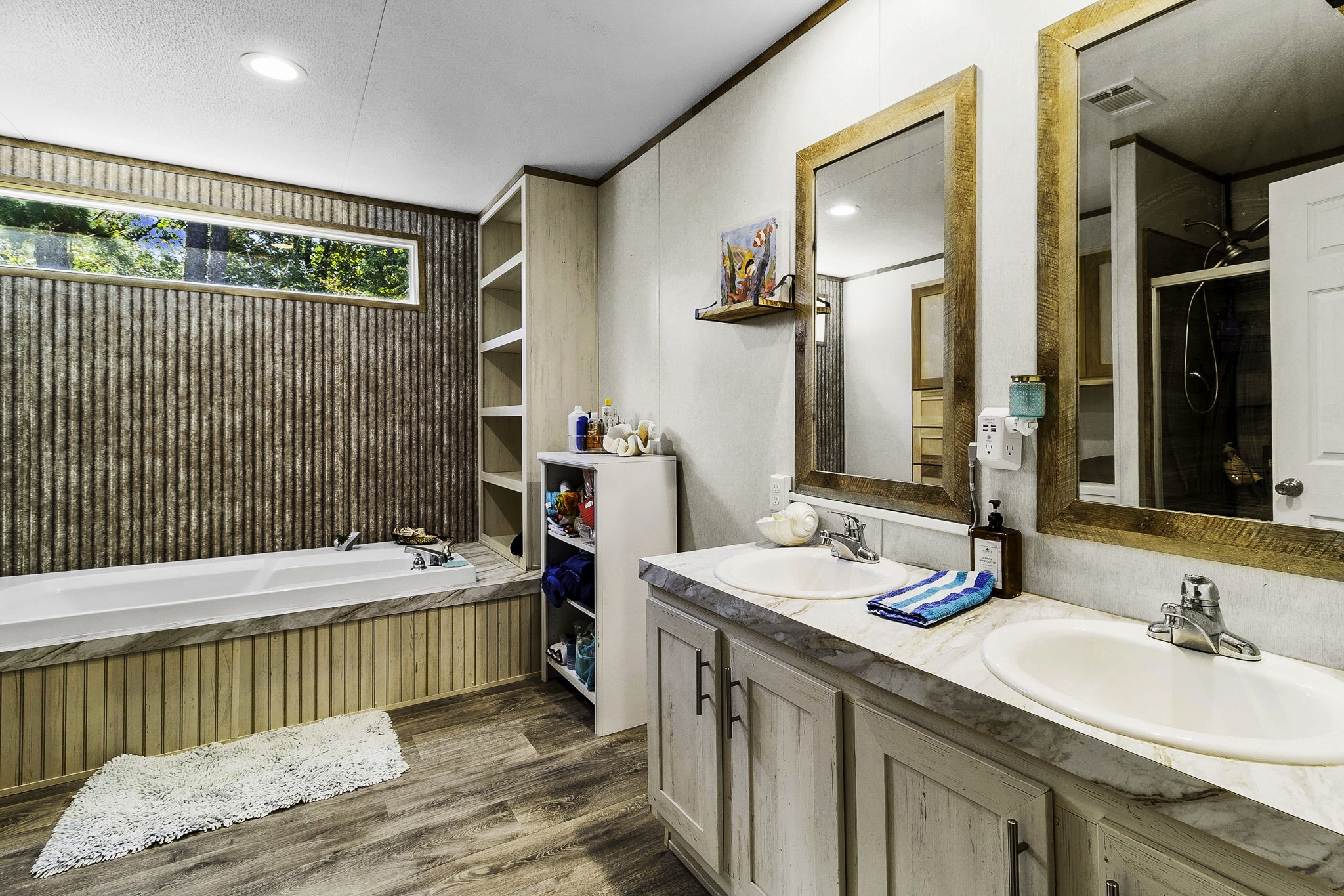 41 Ferguson Way Point Blank, TX 77364 - Photo 21 of 34 a bathroom with a sink and a mirror