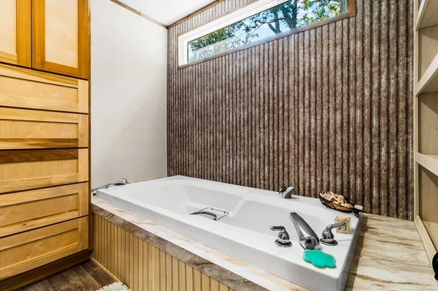 a view of balcony with wooden floor and fence