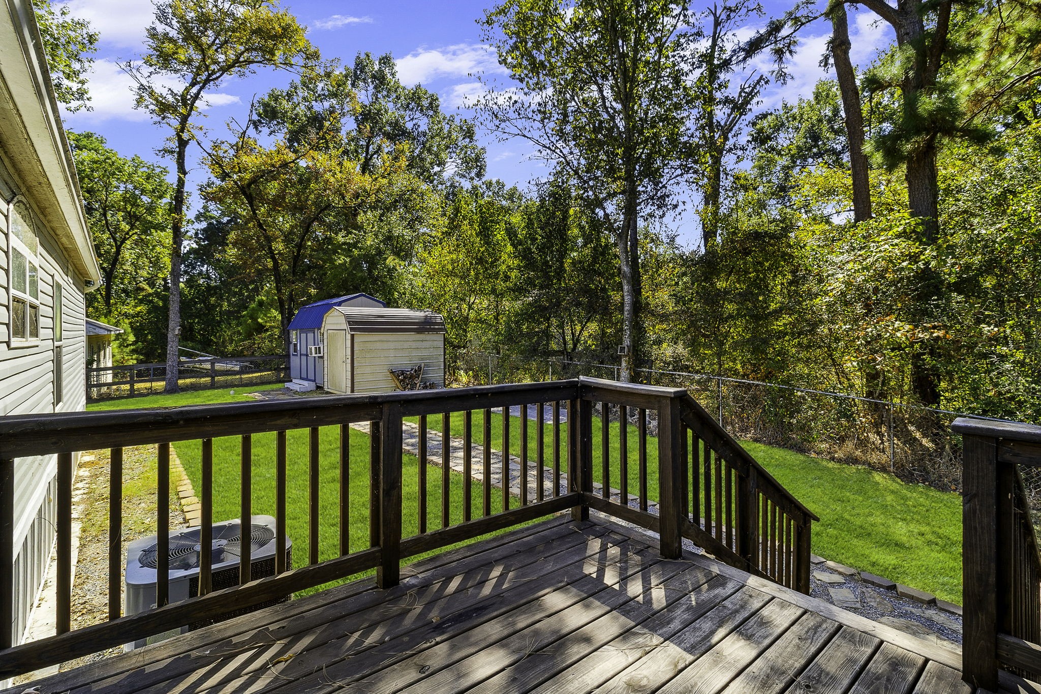 41 Ferguson Way Point Blank, TX 77364 - Photo 23 of 34 a view of balcony with wooden floor and fence