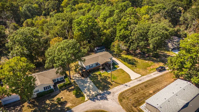 view of the house with large trees