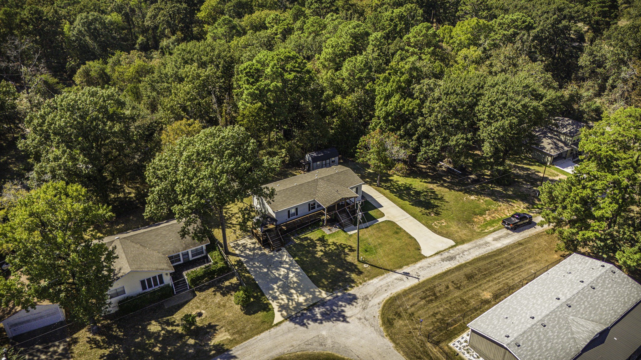 41 Ferguson Way Point Blank, TX 77364 - Photo 29 of 34 an aerial view of a house with a yard and trees